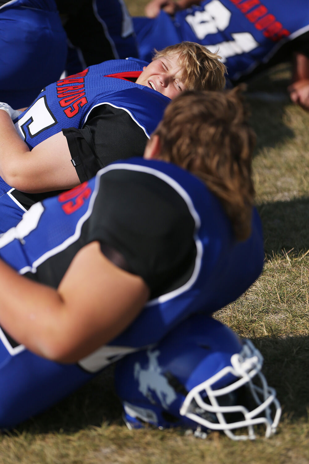 Nickolas Devin looks over at teammate Coy Burnell during half time